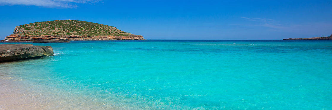 Catamaran day charter Ibiza,, cala conta cove
