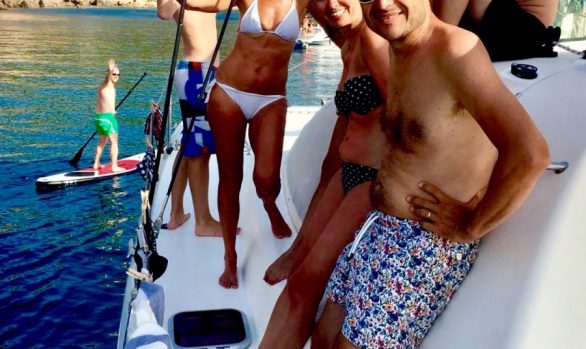 Catamaran hire Ibiza. French family Smiling on board