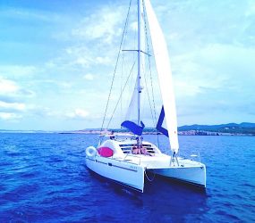 Catamaran charter Ibiza sailing with full sail