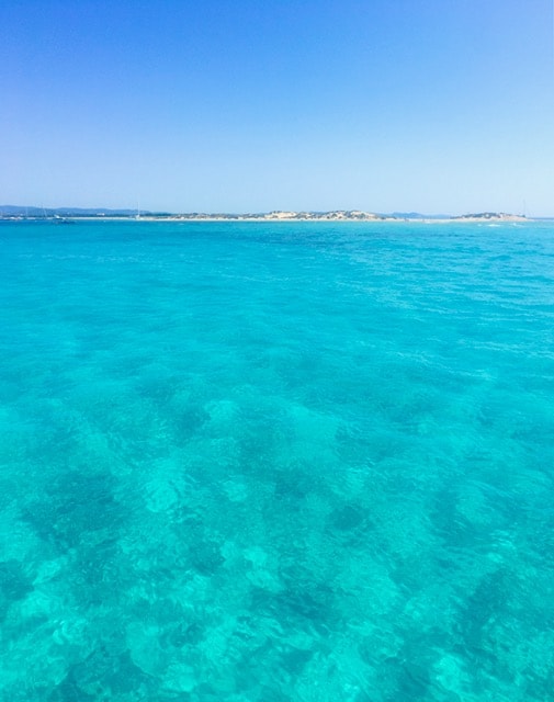 Blue waters of Formentera from the catamaran 