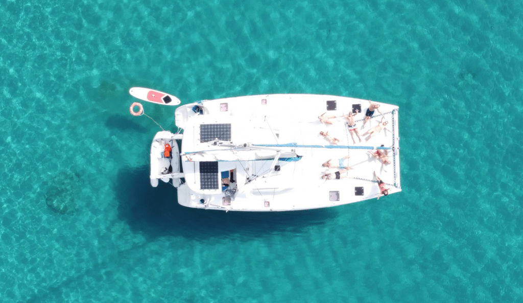 Our catamaran rental in ibiza anchored in cala Tarida