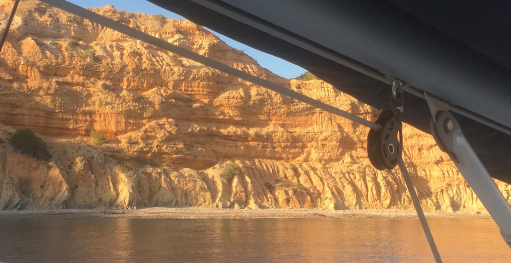 Catamaran Rental Ibiza - the red cliff of Es codolar