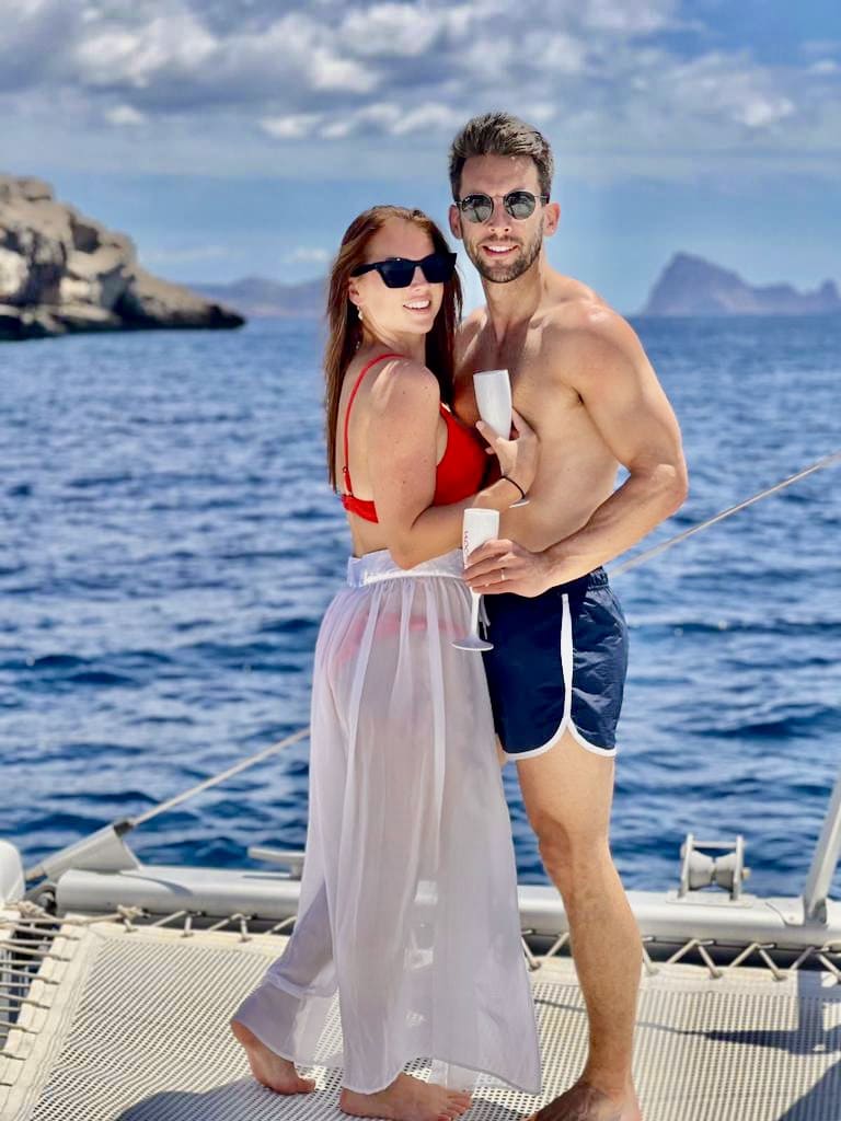 Honeymoon Ibiza on catamaran, happy couple on board